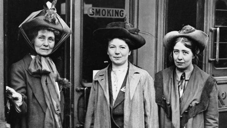 A portrait of the leader of the Women's Suffragette movement, Mrs Emmeline Pankhurst (left) and her daughters Christabel (centre) and Sylvia (right) at Waterloo Station, London. Mrs Pankhurst was about to leave for a lecture tour of the USA and Canada.